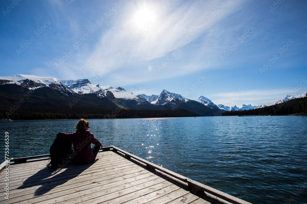 Summer landscape and people kayaking and fishing in Maligne lake, Jasper National Park, Canada