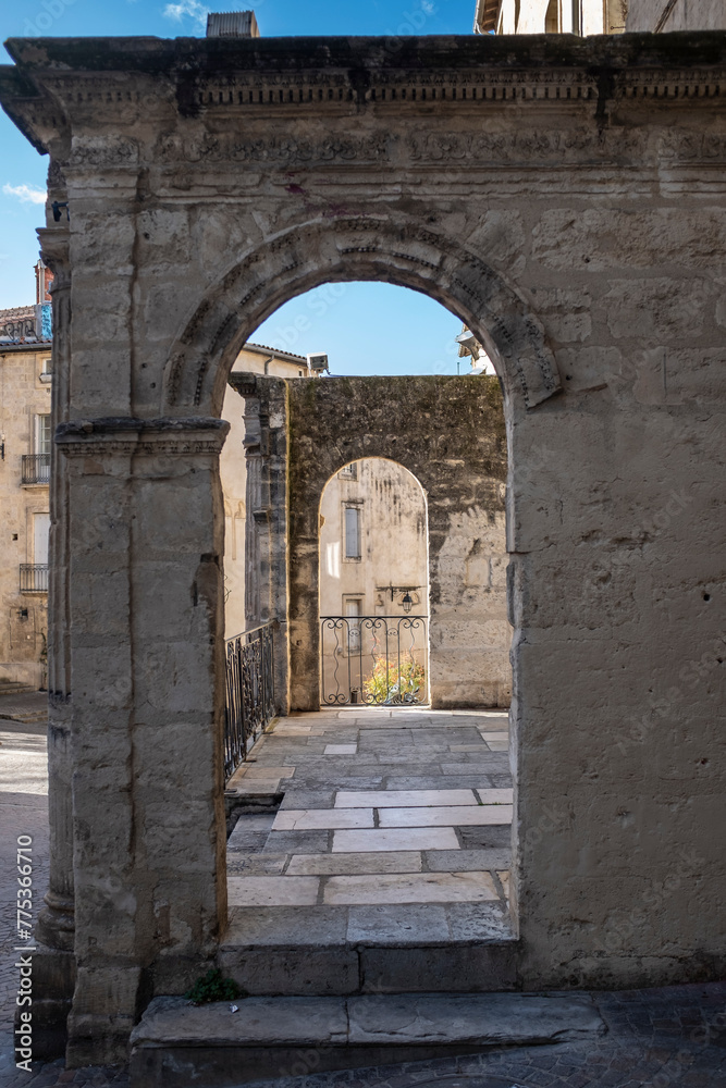 Old ruin arch entrance perspective in a medieval scene in Montpellier, France