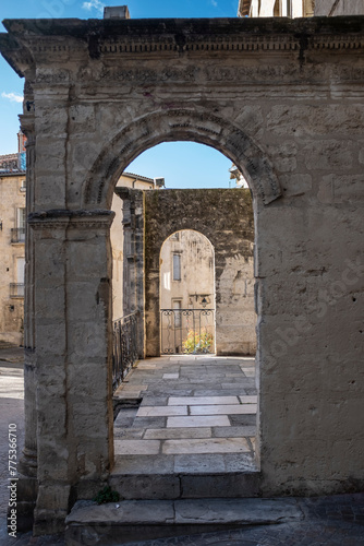 Old ruin arch entrance perspective in a medieval scene in Montpellier, France