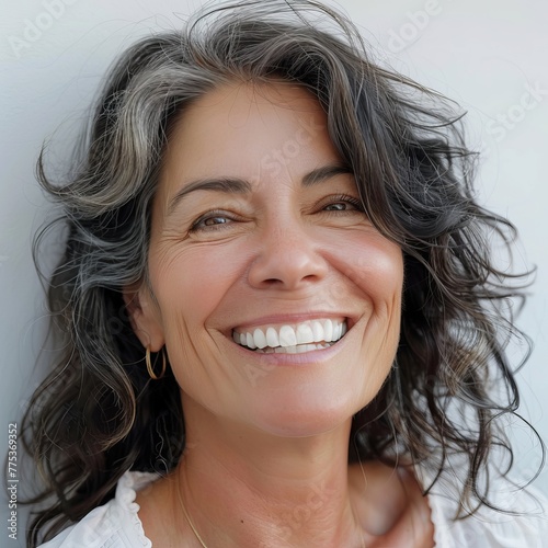close up portrait of a beautiful 52 years old woman on a white background,