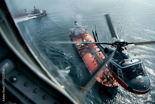Helicopter performing an overflight inspection of maritime vessels photo