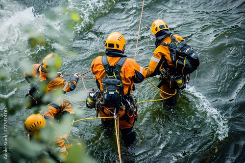 Emergency services conduct a technical water rescue from a bridge