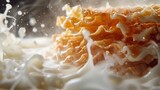 Milk splash and stack of crackers with cream