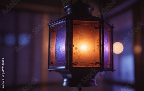 A lantern hangs from the ceiling, casting colorful light in the dark room