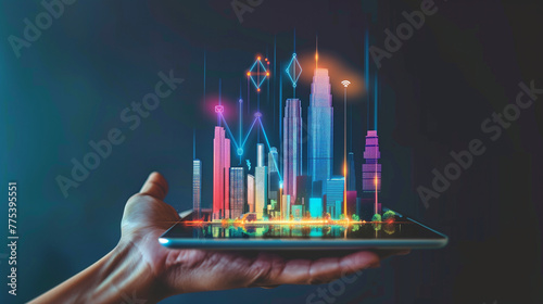 Tablet with Buildings Hologram and Raising Graph, Property Investment 
Real estate business investment and building technology. Hand holding digital tablet with buildings hologram and raising graph