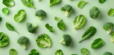 green leafy vegetables and broccoli florets arrangement on soft green background