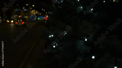 Wallpaper Mural Pine tree with garland by car street. A view of bright pine tree along the city street with cars in the night. A concept of Christmas decoration in the city. Torontodigital.ca