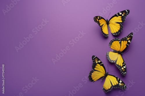 Three pollinator butterflies with yellow wings are flying gracefully across a vibrant purple background, showcasing the beauty of arthropods in nature