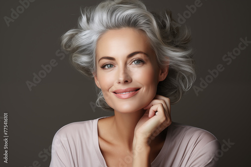 Radiant senior woman with stylish gray hair smiling