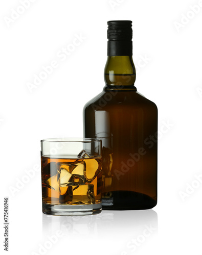 Whiskey in glass and bottle isolated on white