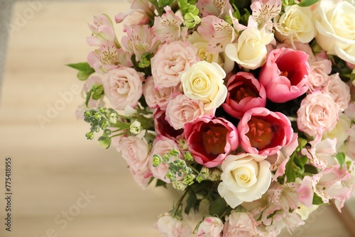 Beautiful bouquet of fresh flowers on table indoors, closeup