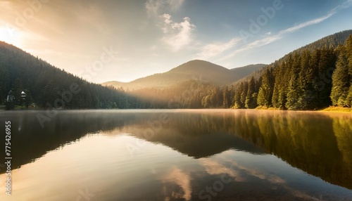 stunning morning view of lacu rosu lake misty summer scene of harghita county romania europe beauty of nature concept background photo