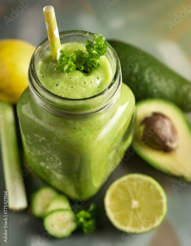 Vegetarian healthy green smoothie from avocado, spinach leaves, apple and chia seeds on gray concrete background. Selective focus. Space for text