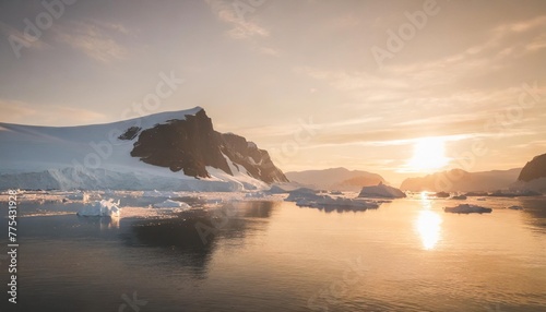 antarctic nature landscape with icebergs in greenland icefjord during midnight sun photo