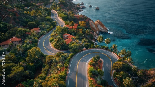 A winding road through natural landscape ending at the beach
