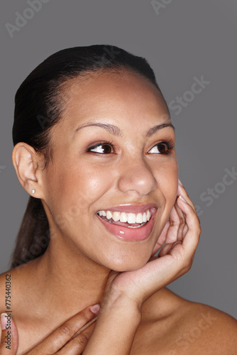 Smiling woman, skincare and thinking with pride in studio for dermatology, beauty and facial cosmetics. Happy female person, wellness and aesthetic results for confidence isolated on gray background.