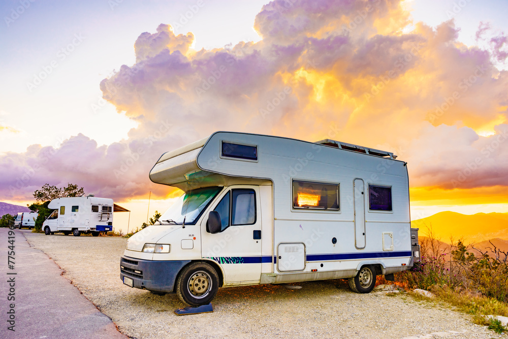 Rv camper in mountains at sunset, France.