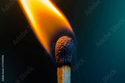 A matchstick is lit and the flame is yellow