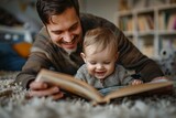 A man and a baby are reading a book together