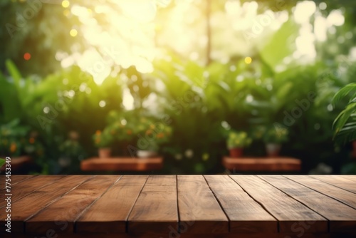 Empty wood plank table top with blur park green nature background bokeh light  Mock up for display or montage of product  Banner or header for advertising on social media. High quality photo