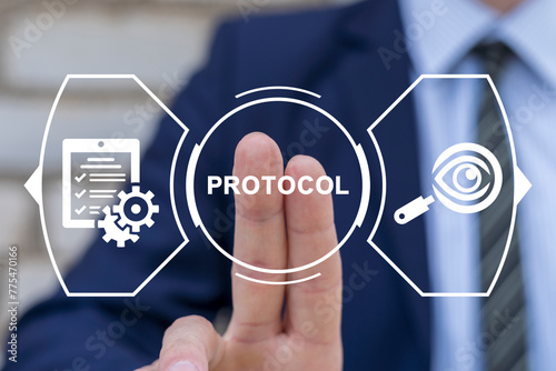 Businessman using virtual touchscreen presses text: PROTOCOL. Protocol busines concept. Protocols Procedures Rules Regulation Compliance Technology.