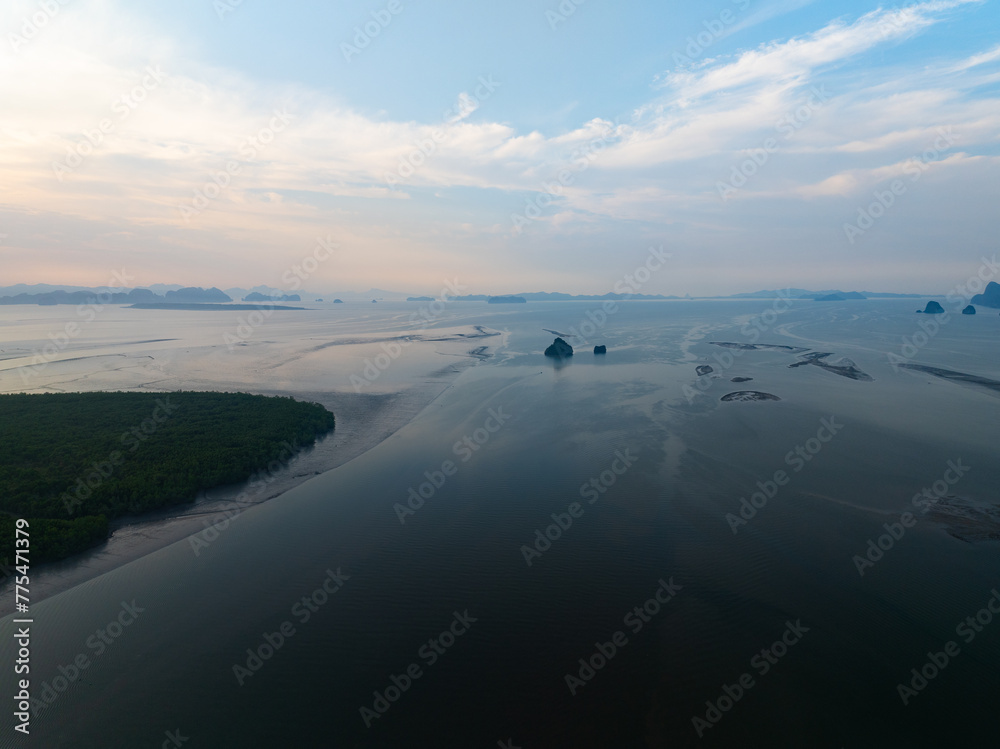 Amazing mountains abundant mangrove forest,Aerial view of forest trees in sunrise or sunset sky over sea