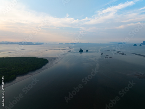 Amazing mountains abundant mangrove forest Aerial view of forest trees in sunrise or sunset sky over sea