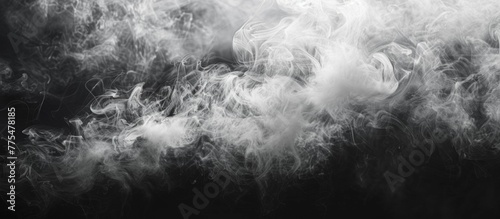Smoke swirling in the air on a dark backdrop