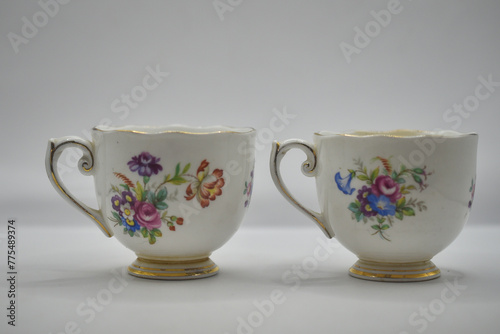 vintage porcelain tea cup with floral patterb photo