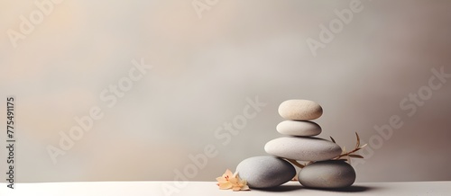 Spa balance meditation and Zen minimal modern concept Stack of stone pebbles against beige wall. Harmony in Stone Modern Meditation Concept