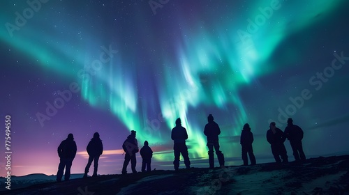 Group of people in awe of the aurora borealis celestial spectacle