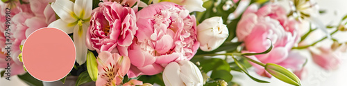 A vase filled with an arrangement of pink and white flowers illuminated by bright sunlight. Banner. Background. Copy space.