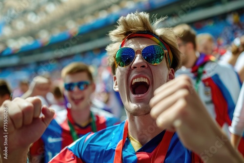 Euphoric fan in sunglasses cheering at a sports event with a crowd in the background