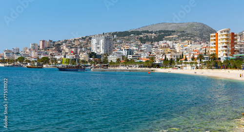 Scenic view of modern cityscape of Sarande on shore of open blue bay of Ionian Sea on sunny spring day  Albania..