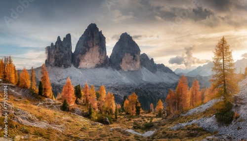 gloomy autumn view of tre cime di lavaredo national park with orange larch trees fantastic morning scene of dolomite alps auronzo di cadore italy europe beauty of nature concept background