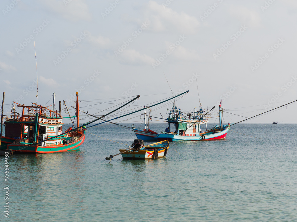 Fishing boat anchored against a clear sky. Sunny day. No people, outdoors. Concept of leisure and travel