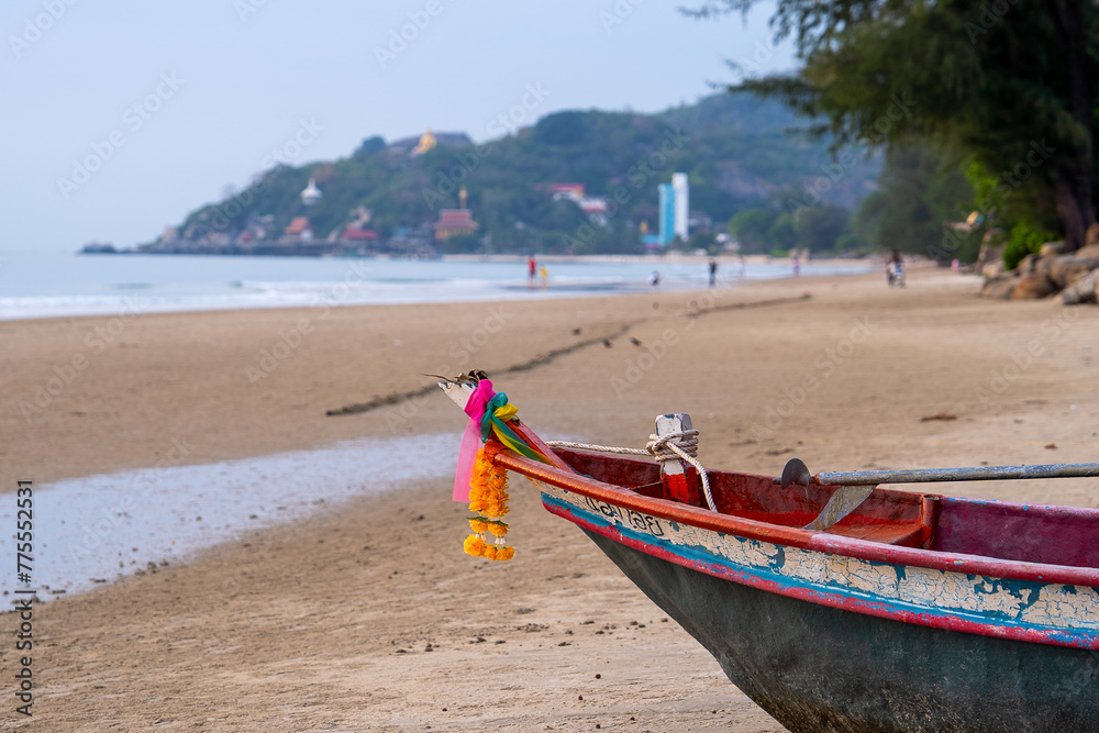 Fototapeta premium Bow of wooden fishing boat stands under a blue sky. Prow, Fishing boat head along the Thai coast.