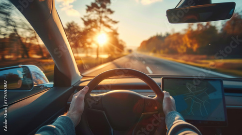 An electric car driver drives an EV at sunset with a blurred sky view inside the car with the car's steering wheel held in his hands