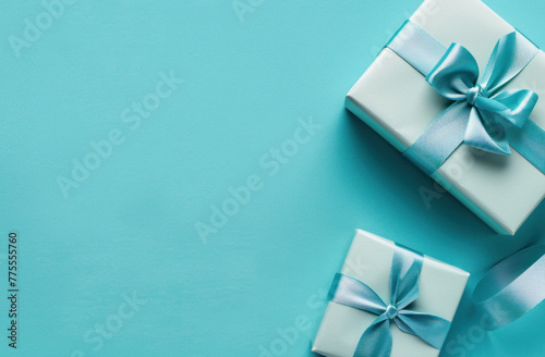 Top view romantic gift box adorned with ribbon on blue background  Present for special occasions.