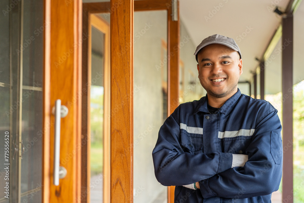 Asian Technician workers in uniform maintenance service. Profession of service industry house fix repair. Home services concept - obrazy, fototapety, plakaty 
