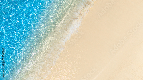 Aerial view of Beach sand background for summer vacation concept. Beach nature and summer seawater with sunlight light sandy beach Sparkling sea water  © Photo Sesaon