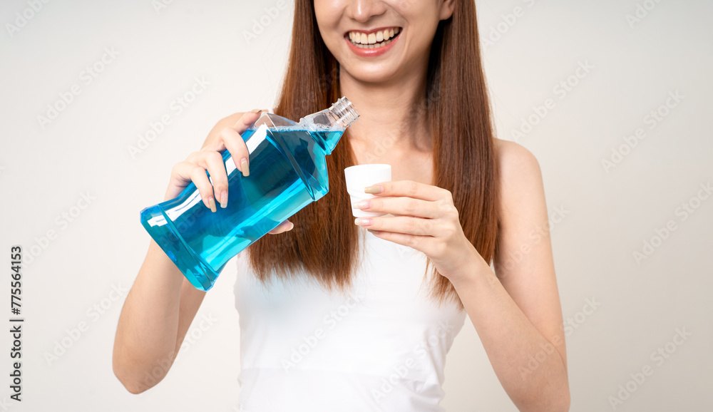 Young asian woman with mouthwash for the health of teeth on isolated. Take care and good dental health fresh breath with mouthwash. Young asian woman with mouthwash for the health of teeth on isolated. Take care and good dental health fresh breath with mouthwash.