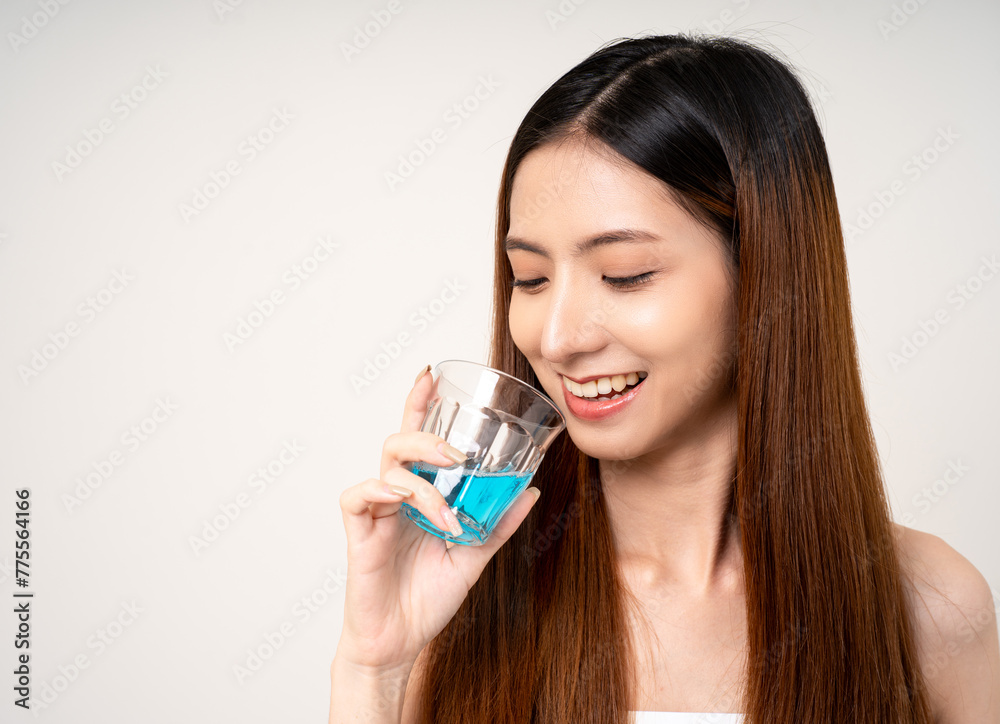 Young asian woman with mouthwash for the health of teeth on isolated. Take care and good dental health fresh breath with mouthwash. Young asian woman with mouthwash for the health of teeth on isolated. Take care and good dental health fresh breath with mouthwash.