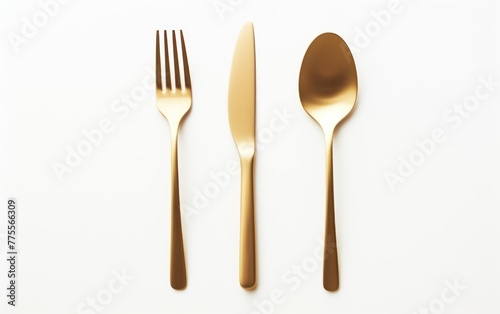 Golden cutlery set on a white background