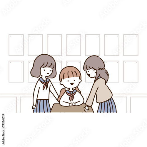 教室で友達と楽しくおしゃべりする3人の女子高生