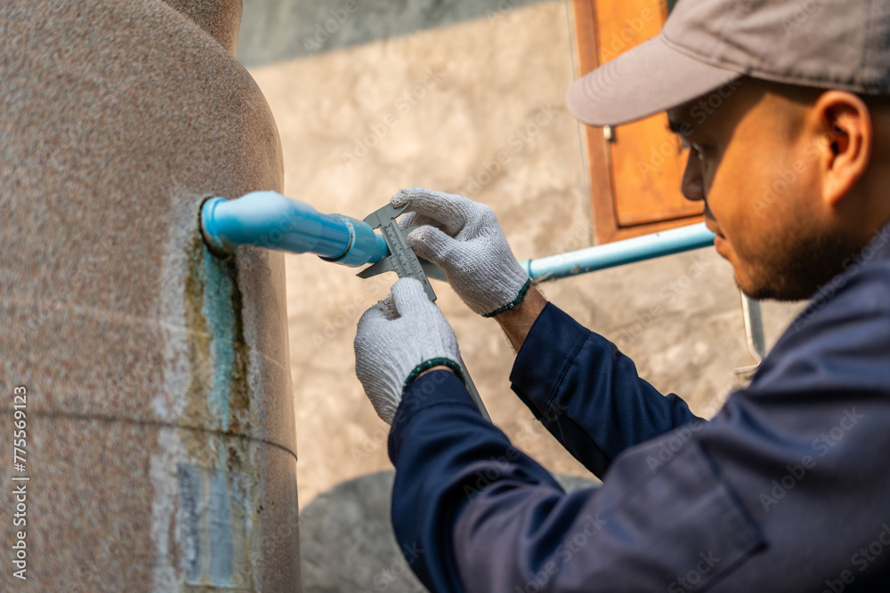 Male Plumber worker installation pipe system hand holding the water tap faucet. Plumbing checking service and repair. Male Plumber worker installation pipe system hand holding the water tap faucet. Plumbing checking service and repair.