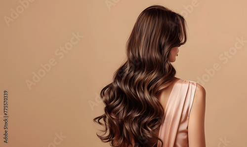 Model woman from behind with beautiful long wavy hair, dyed hair