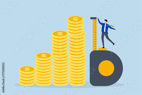 Investment measurement, investor measuring tape measure to measure height of stack of coins.