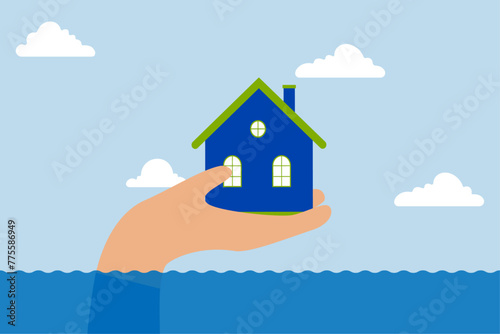 House insurance protection from disaster, large human hand helps protect house above flood water level from damage.