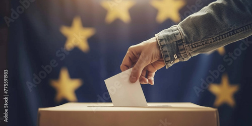 Unrecognizable man putting their vote in the ballot box with European Union flag on background. President governmental election giving your voice voting concept